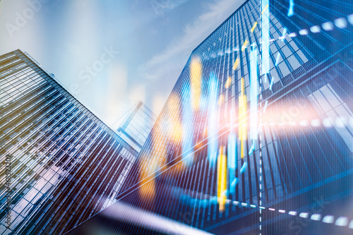Double exposure of abstract financial chart on office buildings background, research and analytics concept