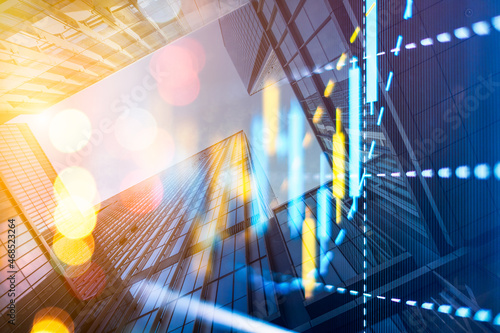 Double exposure of abstract financial chart on office buildings background, research and analytics concept
