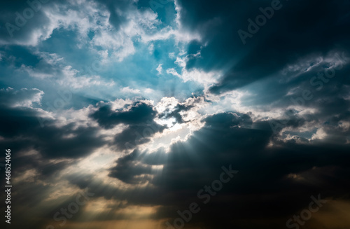 God light. Dark cloudy sky with sun beam. Sun rays through black clouds. God light from heaven for hope and faithful concept. Believe in god. Heaven sky. Overcast sky. Spiritual religious background.