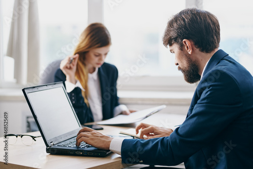 Wallpaper Mural colleagues in the office in front of a laptop career network technologies Torontodigital.ca