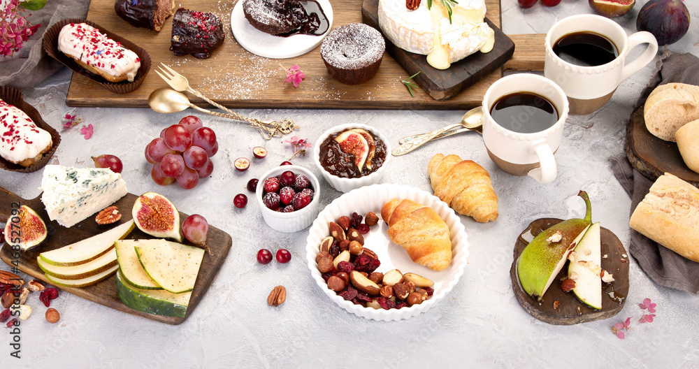 French desserts assortment on gray background. French desserts assortment on gray background.