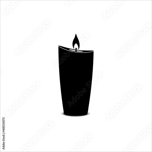 Silhouette of a burning wax candle made of paraffin on a white background.