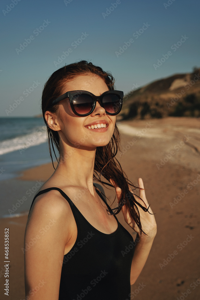cheerful woman sunglasses posing black swimsuit island cheerful woman sunglasses posing black swimsuit island