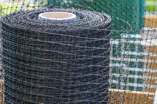 Lawn mesh made of polypropylene for protection from moles. Industry for farming. Focusing with a small depth of field.