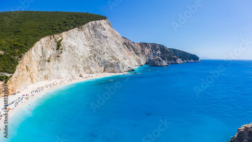 Aerial shots of famous tourist location of paradise beach in Lefkada, Greece. Luxury yacht boat in Porto Katsiki legendary cliffs and views of breathtaking seascapes