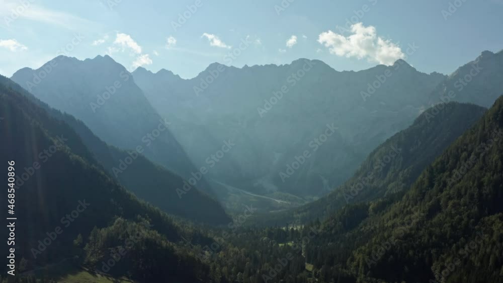 Aerial view landscape of the Alps. Top view of mountain ranges in smog in the morning through the sun's rays. Aerial view landscape of the Alps. Top view of mountain ranges in smog in the morning through the sun's rays.