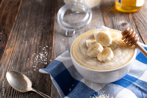 Light food breakfast with millet porridge, bananas and honey, easily digestible
