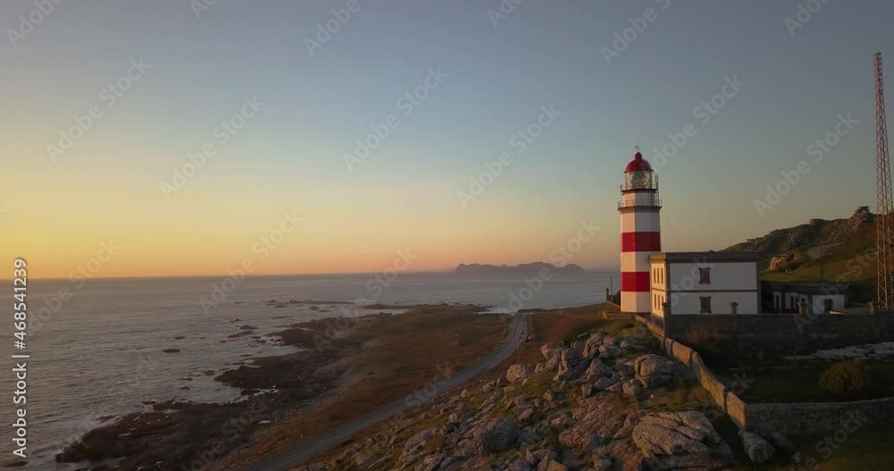 Cape Silleiro Lighthouse At Sunrise With Overview Of Atlantic Ocean In Pontevedra, Spain. drone panning Cape Silleiro Lighthouse At Sunrise With Overview Of Atlantic Ocean In Pontevedra, Spain. drone panning