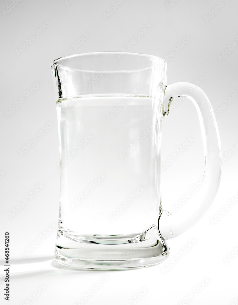 glass of drinking water, studio background with lights and shadows. concept of purity, drinking water, healthy lifestyle or medical. glass of drinking water, studio background with lights and shadows. concept of purity, drinking water, healthy lifestyle or medical.