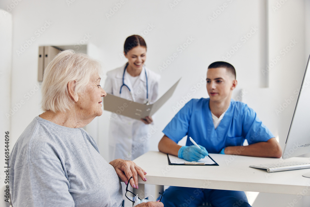 elderly patient hospital examination in the medical office elderly patient hospital examination in the medical office