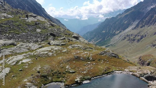 Aereal shot of an alpine valley and a lake photo