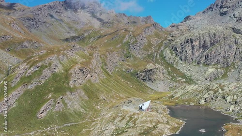 Aereal shot of an alpine valley and a lake photo