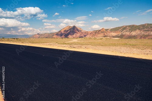 Laying of new black asphalt. Renovation of the expressway and the highway outside the city.
