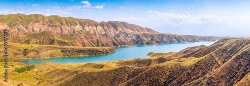 A picturesque reservoir with blue water in an arid area. The concept of recreation on the Azat River in Armenia and land reclamation