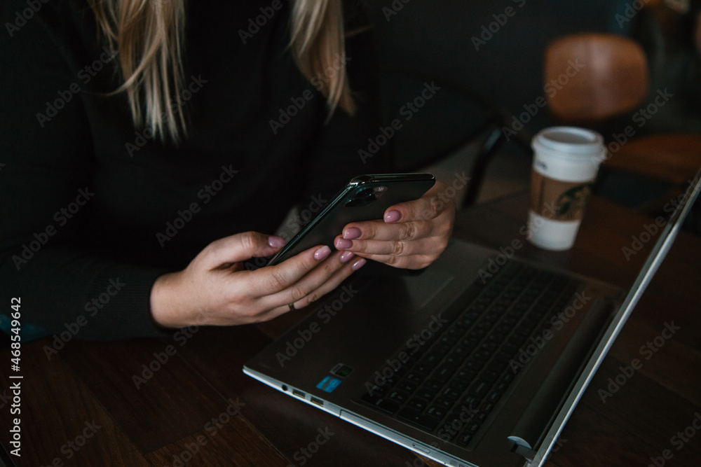 Young influencer in front of the laptop working in the cafe indoors . SMM manager. Young influencer in front of the laptop working in the cafe indoors . SMM manager.