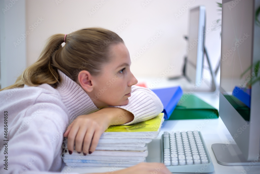 young woman is sad at the workplace. office work concep young woman is sad at the workplace. office work concep