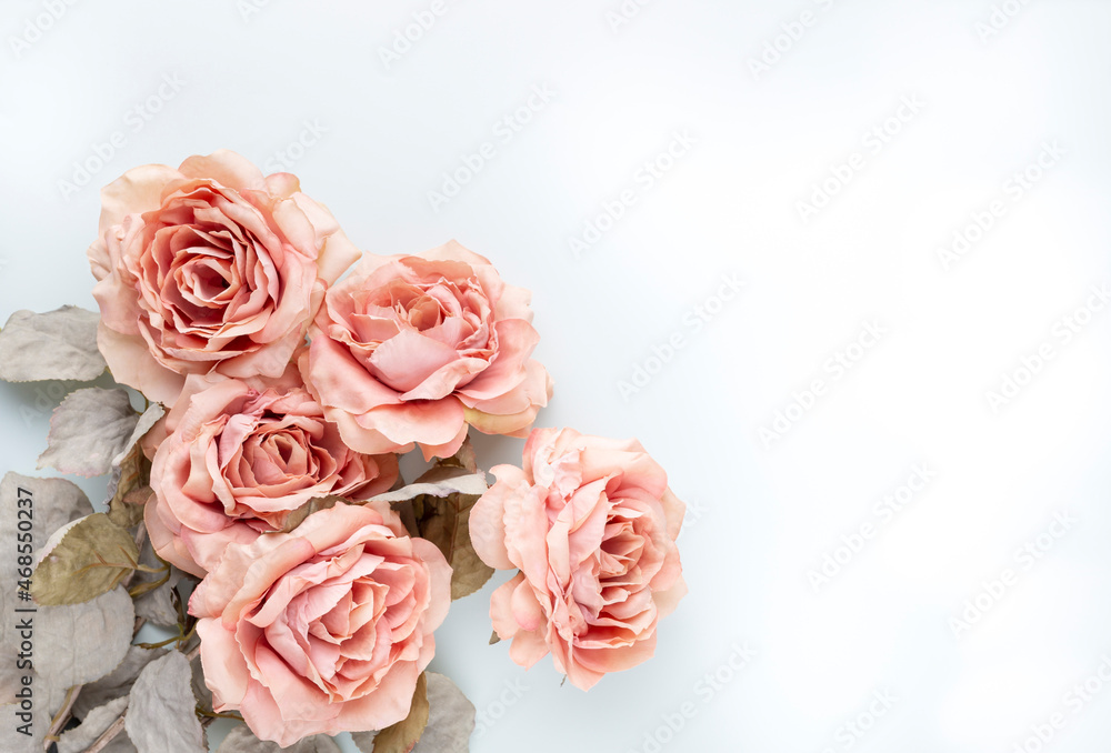 Fototapeta premium Flowers composition. Bouquet of pink roses in pastel colors. Flatlay.