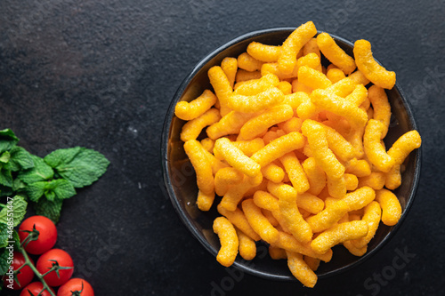 Billede på lærred cheetos snack cheese corn sticks meal snack on the table copy space food background rustic