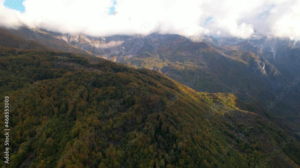 Mountains under clouds in Autumn, colorful foliage of wild forest in Albania Mountains under clouds in Autumn, colorful foliage of wild forest in Albania