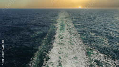 sunset in the ocean on board a ship