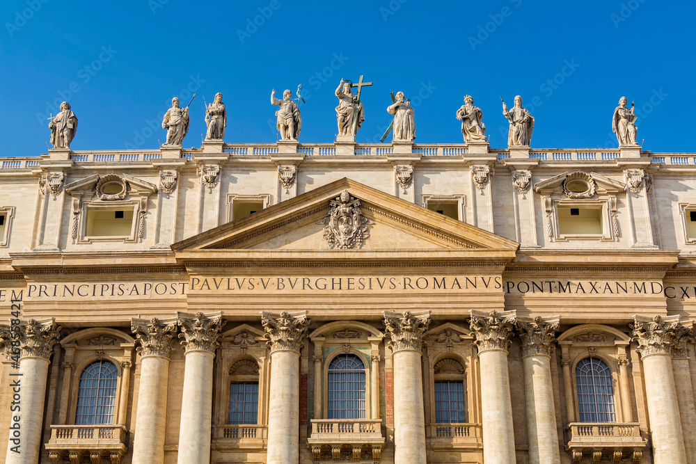 A view of Saints statues on top of St. Peter's Basilica in the Vatican city, Rome, Italy 