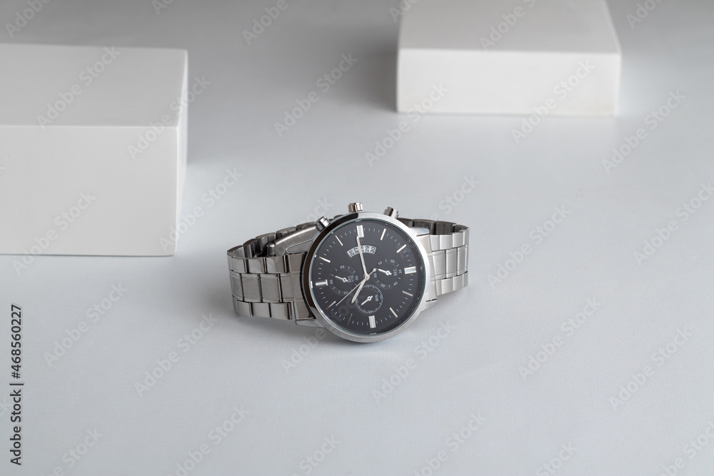 Luxury silver watch on white Table. Business man accessories. Luxury silver watch on white Table. Business man accessories.