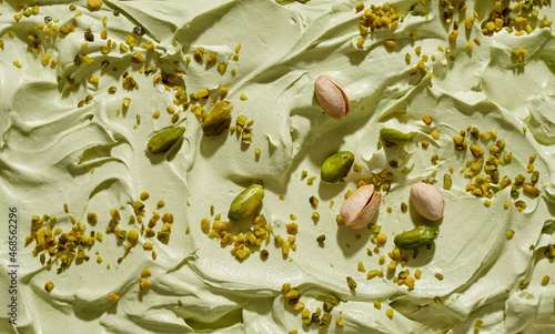 Artisanal homemade green pistachio ice cream with fresh nuts