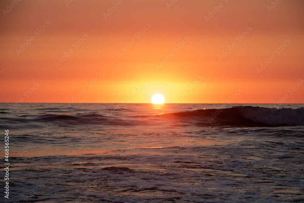 Beautiful orange Sunset at the Beach in El Palmar Andalucia Spain at the Costa de la Luz