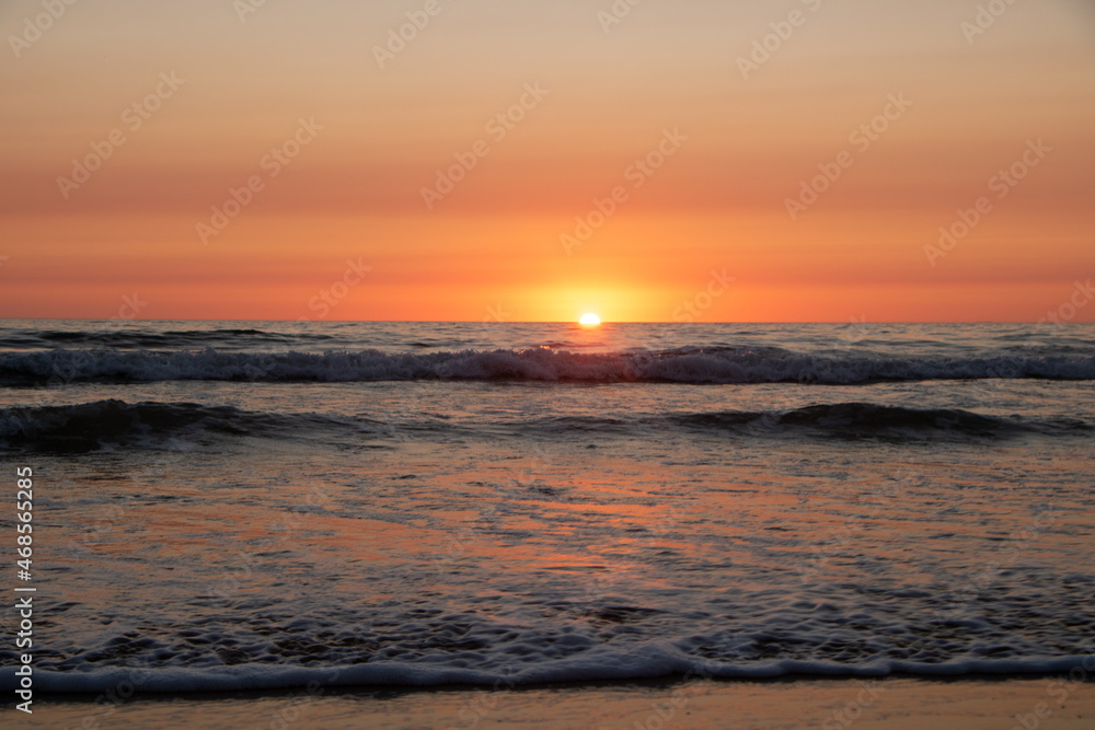 Beautiful orange Sunset at the Beach in El Palmar Andalucia Spain at the Costa de la Luz Beautiful orange Sunset at the Beach in El Palmar Andalucia Spain at the Costa de la Luz