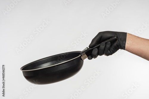 Small frying pan in hand. M...
