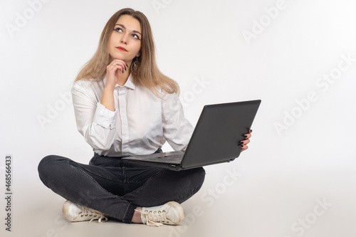 Woman laptop. Girl thought ...