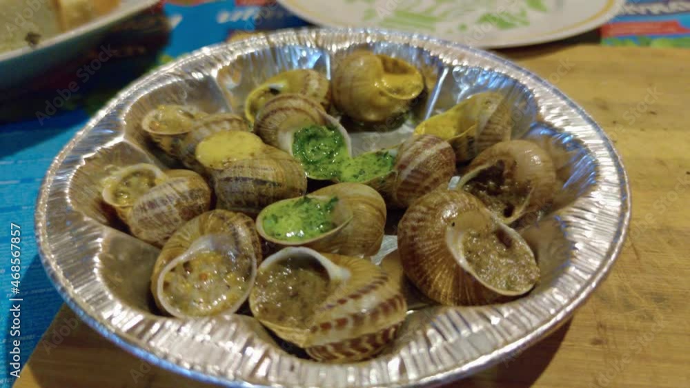 Fried snails with sauce closeup Fried snails with sauce closeup