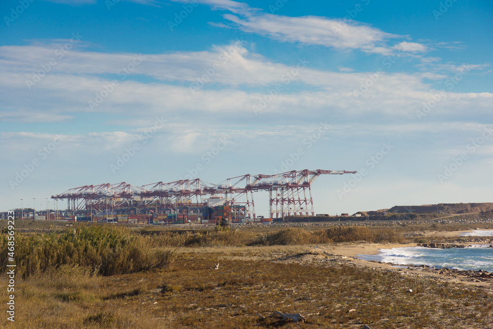 Cranes at the entrance of the port of Barcelona Cranes at the entrance of the port of Barcelona
