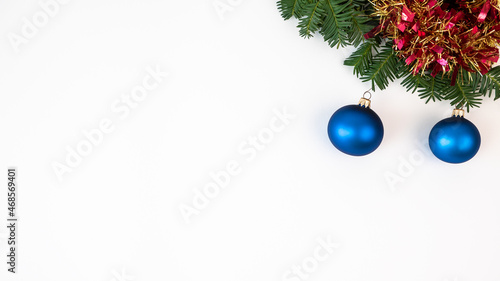 Frame of pine branch and Christmas balls on white background. Xmas decoration