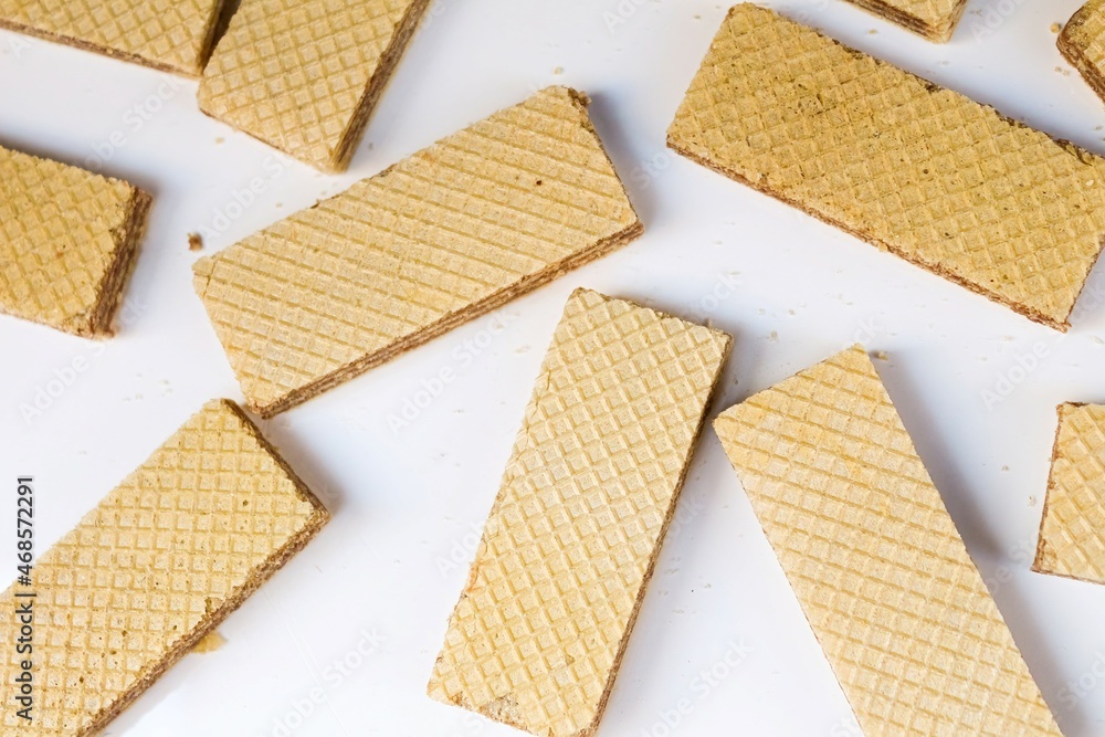 Crispy wafers on a blank (white) background, arranged. Top view. selective focus
Crispy wafers on a blank (white) background, arranged. Top view. selective focus