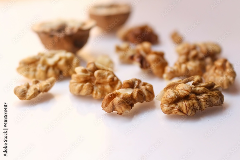 Whole and cracked walnuts on white background Whole and cracked walnuts on white background