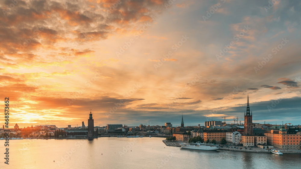 Stockholm, Sweden. Skyline Cityscape Famous View Of Old Town Gamla Stan In Summer Evening. Famous Popular Destination Scenic UNESCO World Heritage Site. Popular City Hall, Riddarholm Church In Sunset.