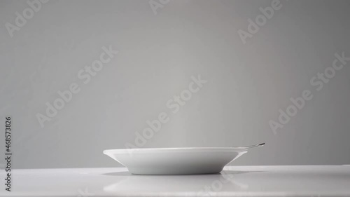 Cup of coffee, white ceramic, grey background 