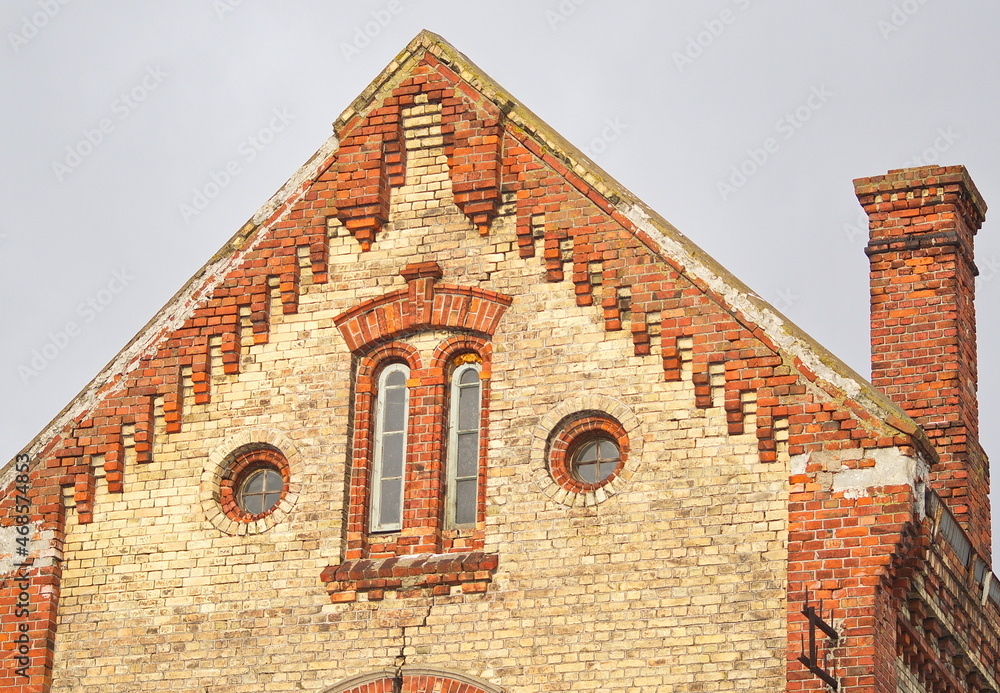 old, historical red and white brick house in Ventspils, Latvia. old, historical red and white brick house in Ventspils, Latvia.