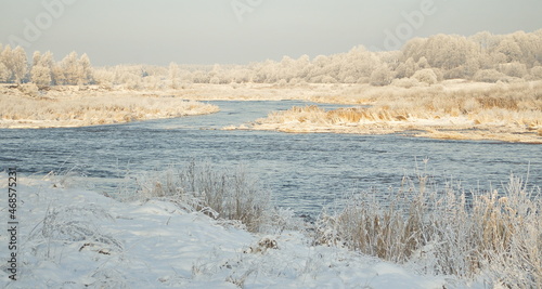 White frost in beautiful sunny winter day in river Venta, Kuldiga, Latvia.