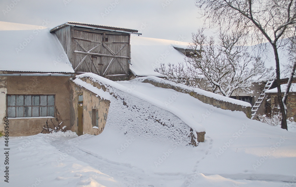 Old horse stables on a winter day, Kuldiga, Latvia. Old horse stables on a winter day, Kuldiga, Latvia.