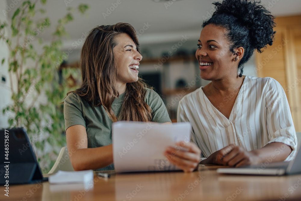 Two diverse colleagues, love working together Two diverse colleagues, love working together