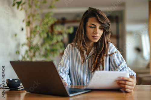 Focused caucasian woman, rewriting a business contract