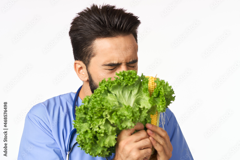 male nutritionist with vegetables in the hands of health calories male nutritionist with vegetables in the hands of health calories