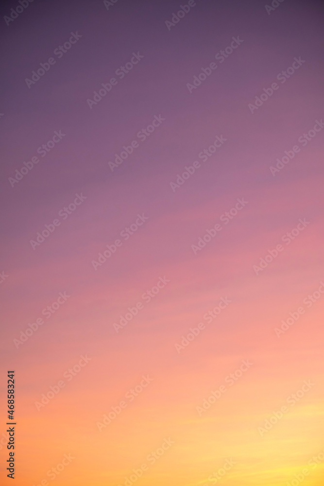 Obraz premium beautiful orange clouds and sunlight on the blue sky perfect for the background, take in everning,Twilight,vertical