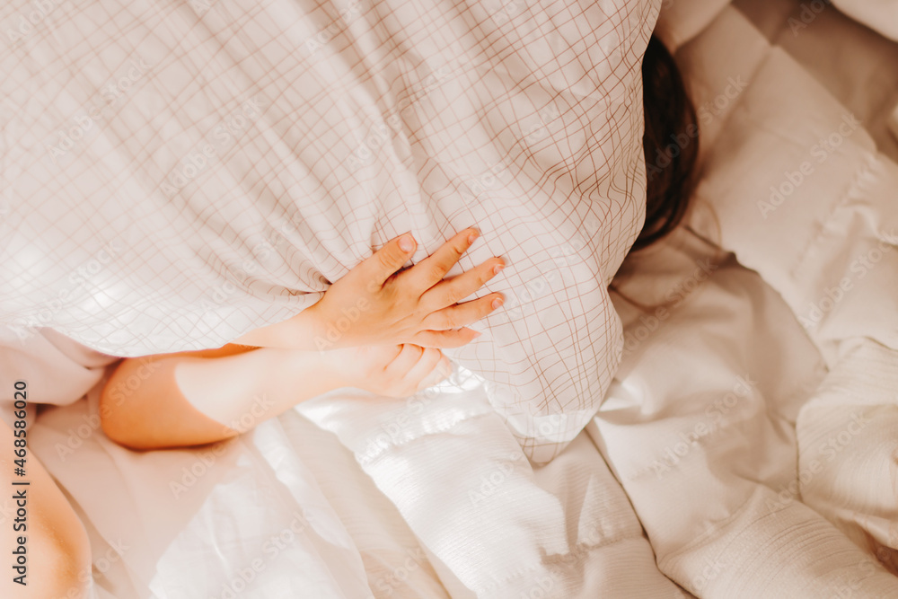 Cute toddler girl lies in bed with white linen. Cute toddler girl lies in bed with white linen.