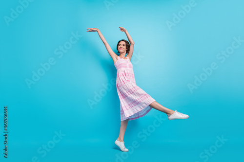 Full body photo of sweet millennial lady dance wear pink long sarafan footwear isolated on blue background