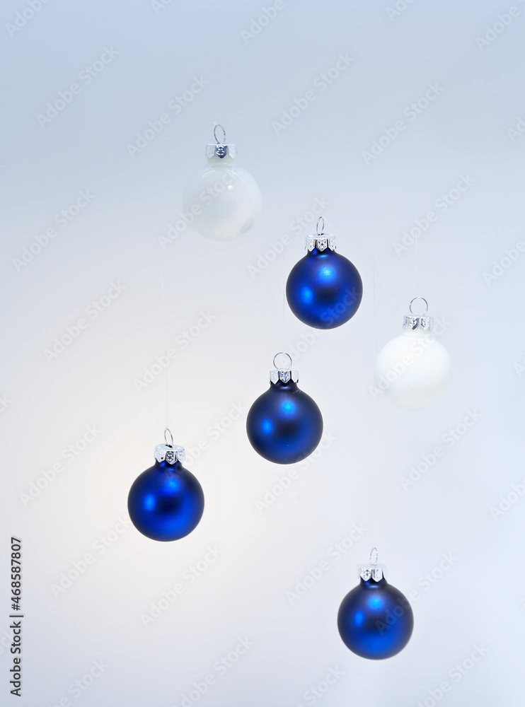 Blue and white christmas balls with shadows on the wall Blue and white christmas balls with shadows on the wall