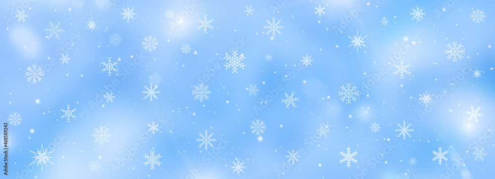 Soft blue winter background with snowflakes and falling snow. Christmas and New Year banner