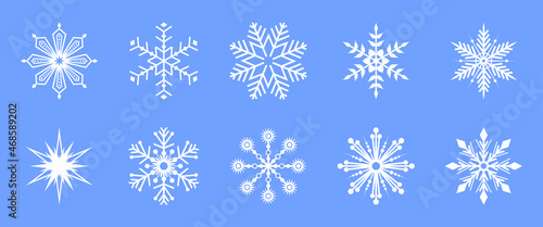 Set of white vector snowflake icons on a blue background. Winter decorative elements